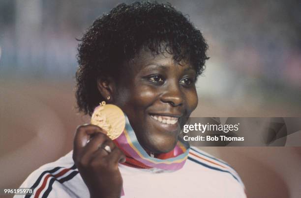 English javelin thrower Tessa Sanderson of the Great Britain team pictured holding her gold medal after finishing in first place in the Women's...