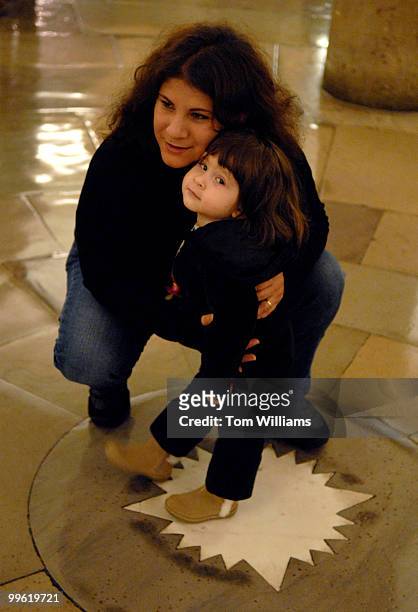 Angelica Prieto-Ortega poses for a picture with her mother Rubi Ortega in the crypt of the Capitol. The star in the center of the floor denotes the...