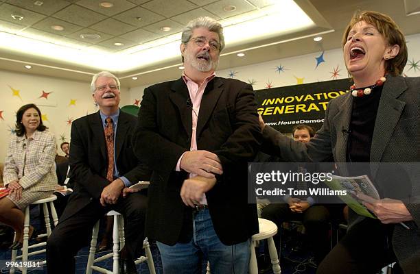 Filmmaker George Lucas, center, cracks up House Minority Leader Nancy Pelosi, D-Calif., during a meeting with 100 college students to discuss the...