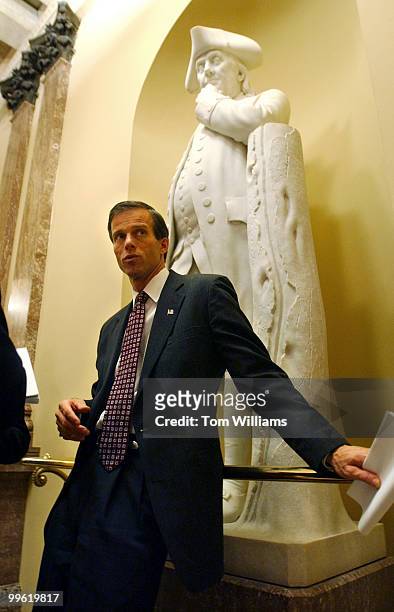 Sen. John Thune, R-S.D., speaks to a reporter after the Senate Luncheons.