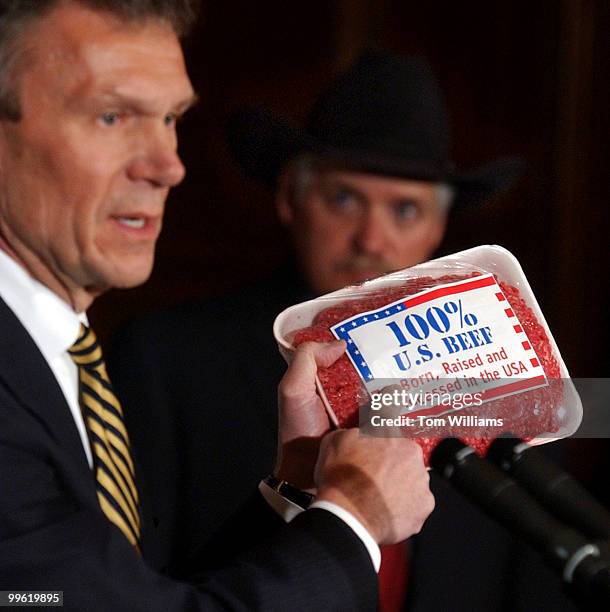 Sen. Tom Daschle, D-S.D., holds a package of U.S. Produced ground beef at a press conference on product labeling and the Mad Cow Disease scare....