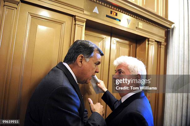 Sen. Mel Martinez, R-Fla., left, speaks with Sen. Chris Dodd, D-Conn., about the housing bill after the senate luncheons, May 13, 2008.