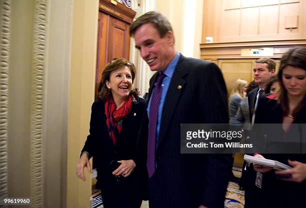 Sens. Mark Warner, D-Va., and Kay Hagan, D-N.C., share a laugh while leaving the democratic senate luncheon, March 10, 2009.