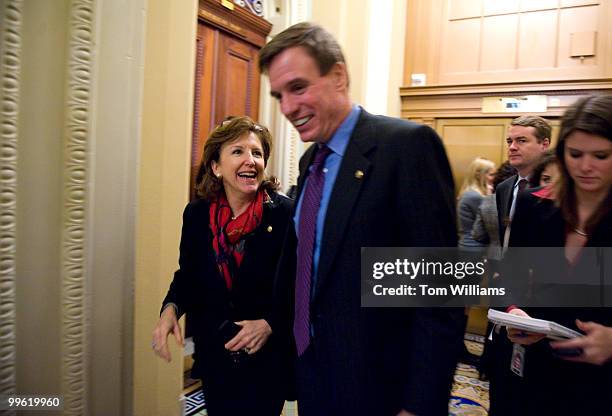 Sens. Mark Warner, D-Va., and Kay Hagan, D-N.C., share a laugh while leaving the democratic senate luncheon, March 10, 2009.