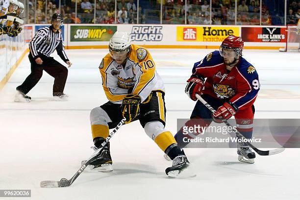 Brayden Schenn of the Brandon Wheat Kings stops the with the puck while being defended by Devon MacAusland of the Moncton Wildcats during the 2010...