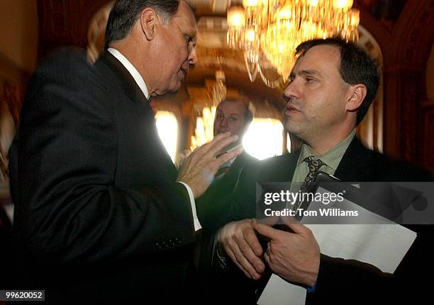 Sen. Mel Martinez, R-Fla., talks with lobbyist Athan Manuel of U.S. PIRG, about the protection of the artic wildlife refuge.