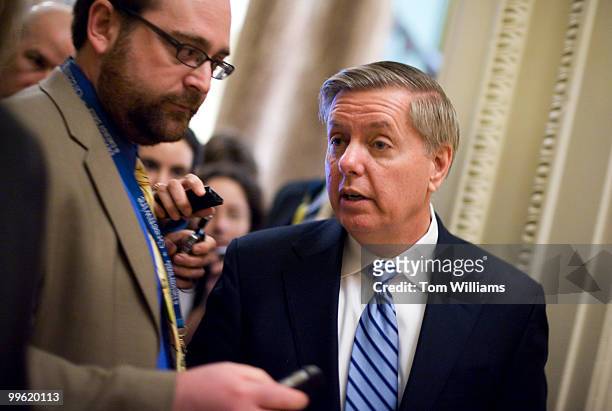 Sen. Lindsay Graham, R-S.C., talks with reporters before the senate luncheons, March 16, 2010.