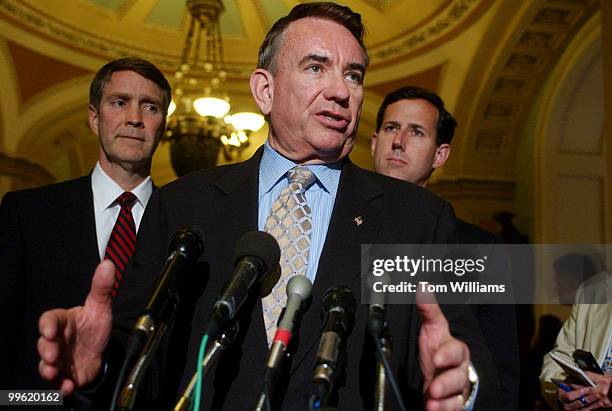 Secretary of Health and Human Services Tommy Thompson, center, speaks to the media with Sens. Rick Santorum, R-Pa., right, and Bill Frist, R-Tenn.,...