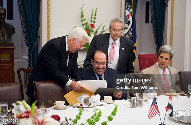 Iraqi Prime Minister Nouri al-Maliki, seated shares a laugh with Sen. Dick Lugar, R-Ind., ranking member of the Senate Foreign Relations Committee...