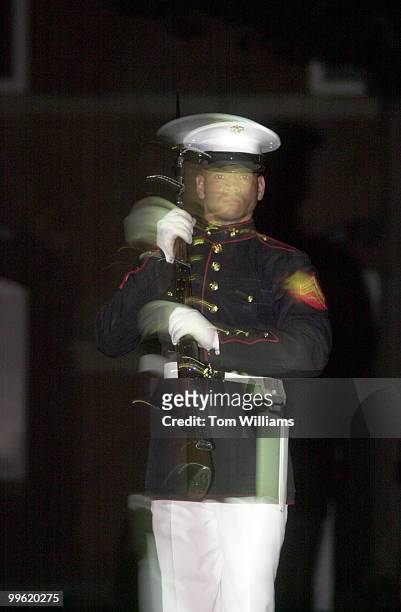 Soldier performs a silent drill at an Evening Parade at the Marine Barracks Washington.