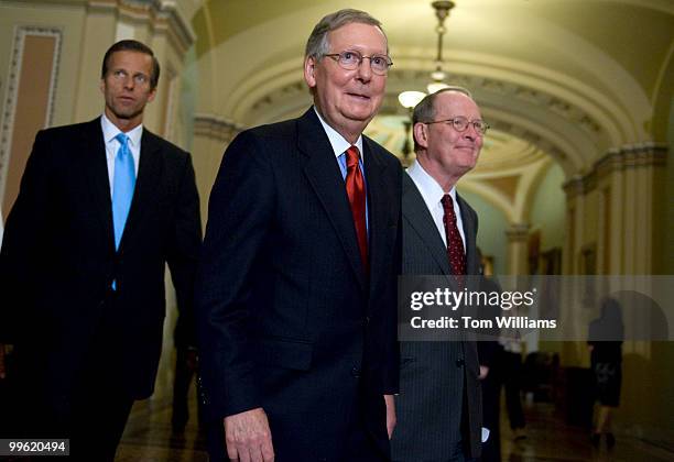 From left, Sen. John Thune, R-S.D., Senate Minority Leader Mitch McConnell, R-Ky., and Sen. Lamar Alexander, R-Tenn., make their way to the media...