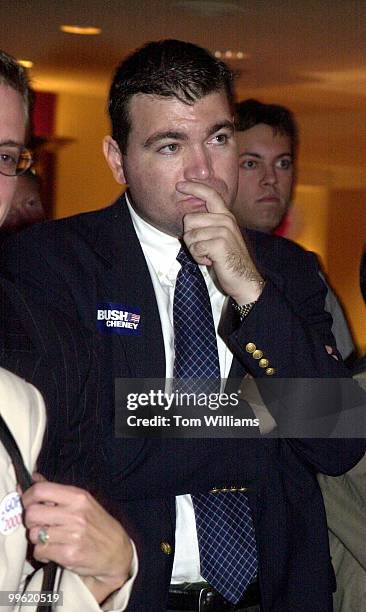 Dan McFaul, staff member of Florida Rep. Joe Scarborough, R-FL, watches returns come in on TV, at the RNC party at the Capital Hilton.