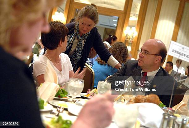 Rep. Jim McGovern, D-Mass., talks with Patricia Baker, center, and Connie Rizoli during a lunch at the 2008 National Anti-Hunger Policy Conference...