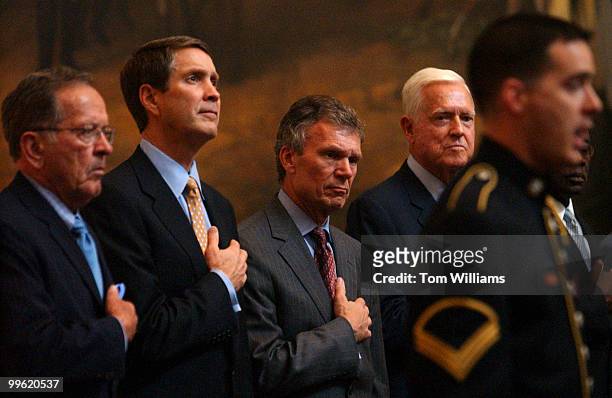 From left, Sens. Ted Stevens, R-Alaska, Bill Frist, R-Tenn., Tom Daschle, S.D., and Fritz Hollings, D-S.C., listen to the "Star Spangled Banner,"...