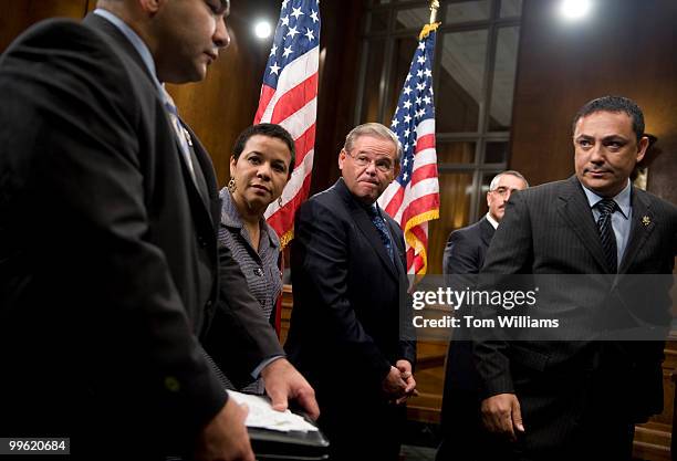 Sen. Robert Menendez, D-N.J., center, conducts a news conference with hispanic leaders including Hector Ramos, left, New Jersey State Police, Ramona...