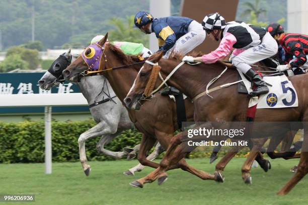 Jockey Gerald Mosse riding Winnam wins Race 8 Big Profit Handicap at Sha Tin racecourse during Season Finale race day on July 12 , 2015 in Hong Kong.