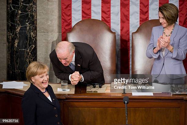 Chancellor of Germany Angela Merkel has a word with Vice President Joe Biden as Speaker Nancy Pelosi, D-Calif., looks on after Merkel addressed a...