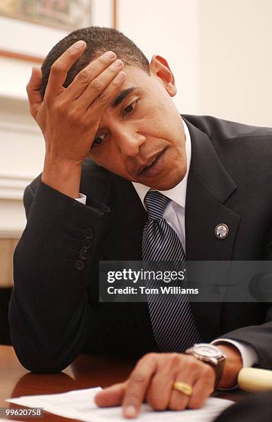 State Sen. Barack Obama, D-Ill., waits for Sen. Tom Daschle, D-S.D., to call constituents in Illinois and ask for donations to the DSCC.