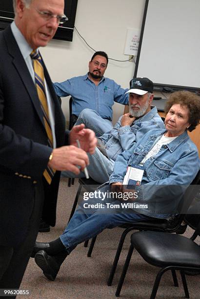 Ken Flores, center, alone with his parents Luis and Eloisa attend a meeting with Rep. Steve Pearce, R-N.M., at Luna Community College in Santa Rosa,...