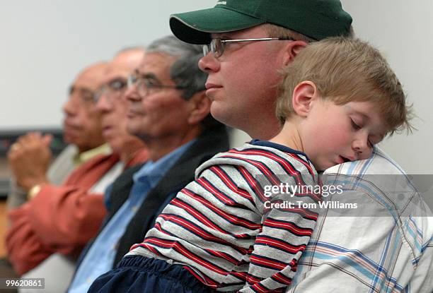 Leonard Rice holds his son Chance at a meeting with Rep. Steve Pearce, R-N.M., at Luna Community College in Santa Rosa, N.M.