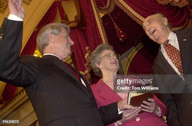 Zell Miller is sworn into the Senate by Strom Thurmand as Miller's wife holds the Bible.