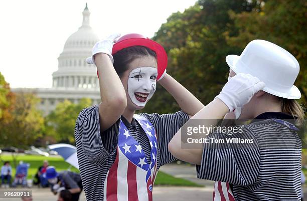 Members of a mime group from Action Ministry, 16 year old Nicki Dixon, left, of New Jersey and Melissa Entzian, 17 of Colorado, prepare for a show in...