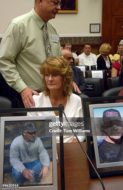 Wendy Black gets encouragement from her brother Carl Sitterud, after displaying pictures of her husband Dale "Bird" Black who was killed while trying...