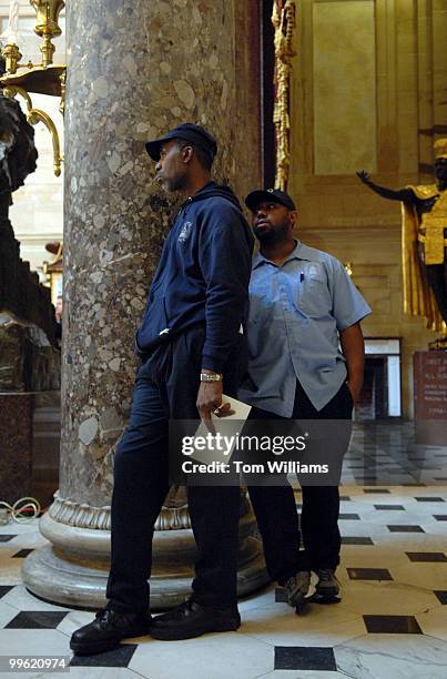 Architect of the Capitol employees, William Warley, left, and Shariff Washington attend a ceremony to honor the 40th anniversary of the assassination...