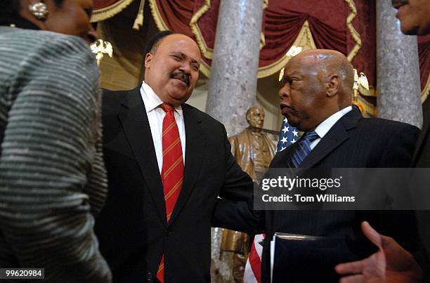 Martin Luther King III, left, greets Rep. John Lewis, D-Ga., after a ceremony to honor the 40th anniversary of the assassination Martin Luther King...