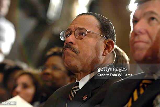 Rep. Sanford Bishop, D-Ga., holds back tears while listening to Martin Luther King III, speak during a ceremony to honor the 40th anniversary of the...