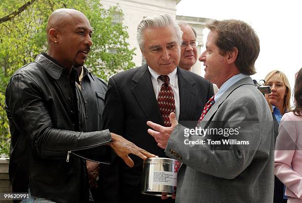 Montel Williams, a multiple sclerosis suffer, Rep. Maurice Hinchey, D-N.Y., and Irvin Rosenfeld, who suffers from a bone condition, talk after a news...