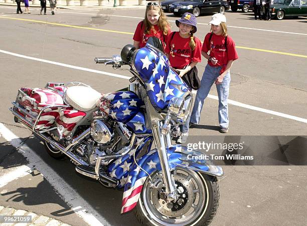 Fith-graders from North Carolina, from left, Murphy Harrell, DeeAnna Strickland and Lauren Logan check Sen. Ben Nighthorse Campbell's Harley Davidson...