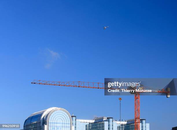 Workers building a crane in front of the European Parliament building. The Paul-Henri Spaak building is the complex of parliament buildings in...