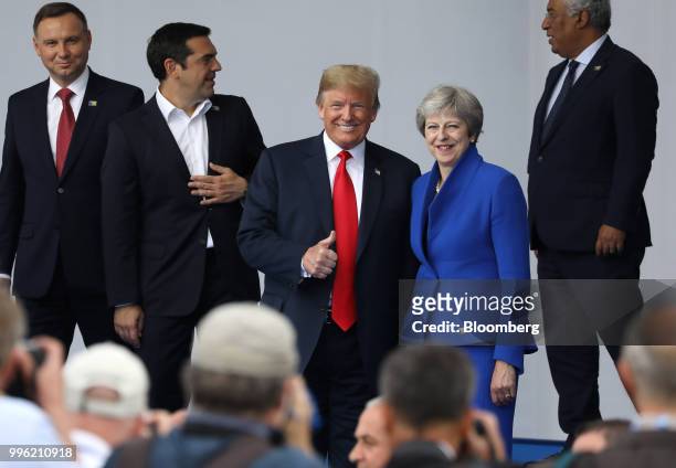 President Donald Trump, center left, and Theresa May, U.K. Prime minister, pose for photographers as world leaders gather for a family photo at the...