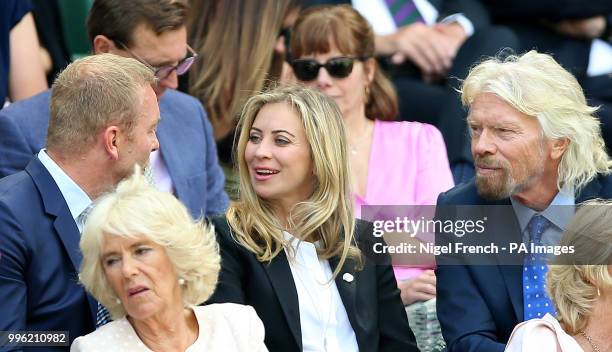 Sir Chris Hoy, Holly Branson and Sir Richard Branson in the royal box on centre court on day nine of the Wimbledon Championships at the All England...