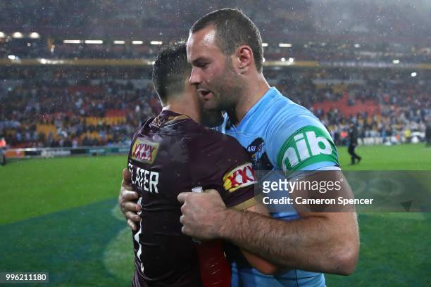 Billy Slater of Queensland and Boyd Cordner of the Blues embrace following game three of the State of Origin series between the Queensland Maroons...