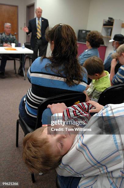 Leonard Rice holds his son Chance at a meeting with Rep. Steve Pearce, R-N.M., at Luna Community College in Santa Rosa, N.M.