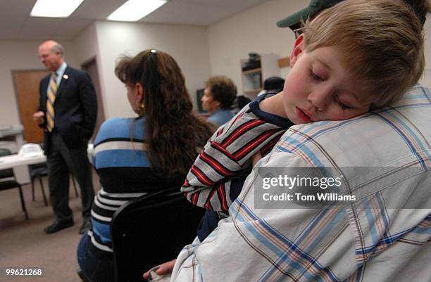 Leonard Rice holds his son Chance at a meeting with Rep. Steve Pearce, R-N.M., at Luna Community College in Santa Rosa, N.M.