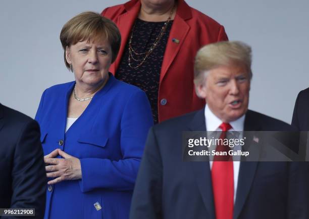German Chancellor Angela Merkel and U.S. President Donald Trump attend the opening ceremony at the 2018 NATO Summit at NATO headquarters on July 11,...