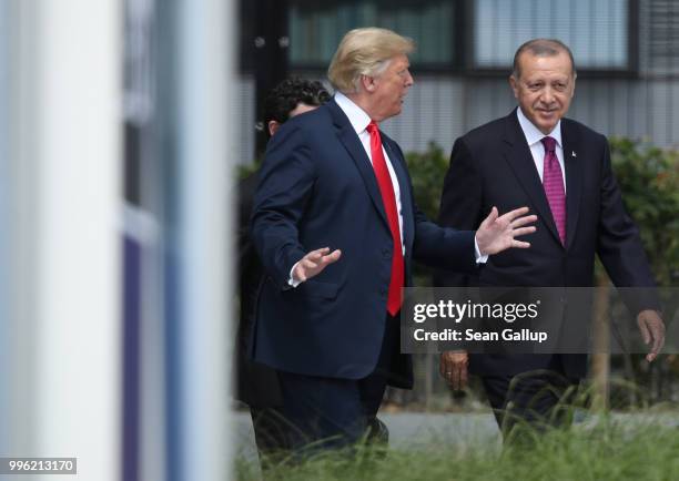 President Donald Trump and Turkish President Recep Tayyip Erdogan attend the opening ceremony at the 2018 NATO Summit at NATO headquarters on July...