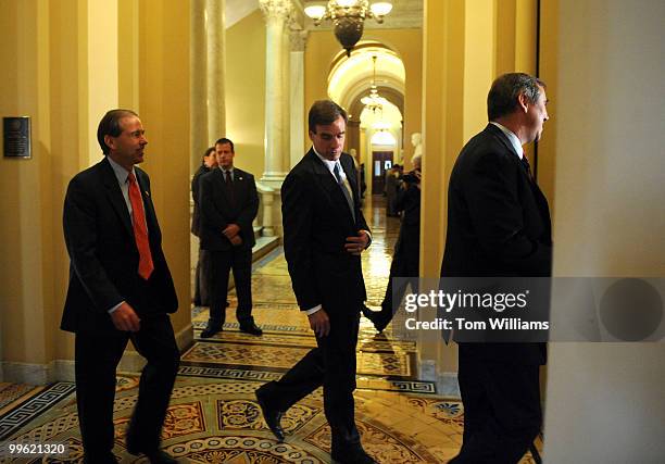 From left Senators-elect Tom Udall, D-N.M., Mark Warner, D-Va., and Jeff Merkley, D-Ore., walk to a news conference introducing freshman democrats to...