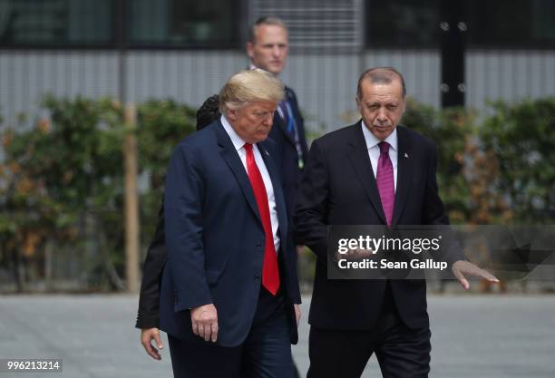 President Donald Trump and Turkish President Recep Tayyip Erdogan attend the opening ceremony at the 2018 NATO Summit at NATO headquarters on July...