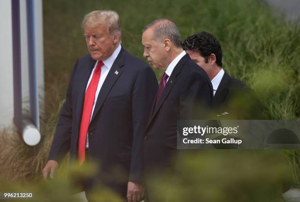 President Donald Trump and Turkish President Recep Tayyip Erdogan attend the opening ceremony at the 2018 NATO Summit at NATO headquarters on July...