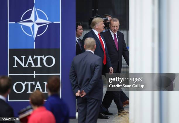 President Donald Trump and Turkish President Recep Tayyip Erdogan attend the opening ceremony at the 2018 NATO Summit at NATO headquarters on July...