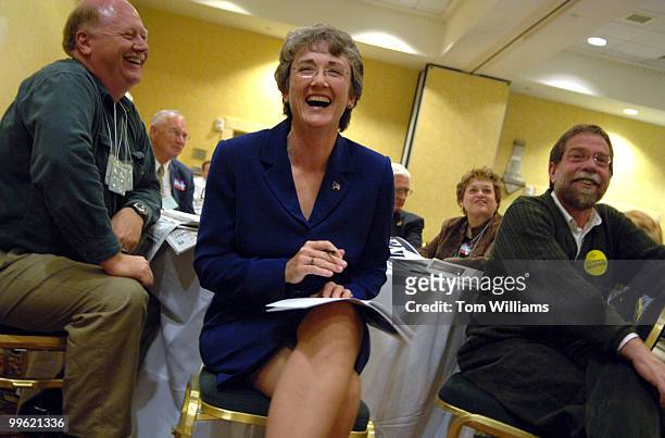 Rep. Heather Wilson, R-N.M., share a laugh with with her husband Jay Hone, left, at the state republican convention at the Marriott hotel in...