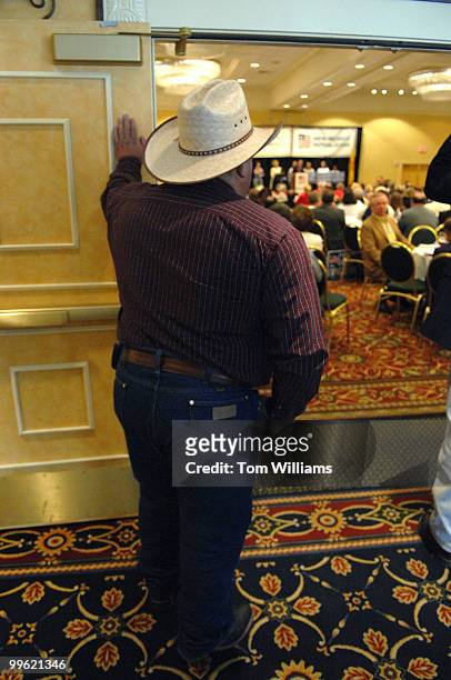 Paul Sanchez of Rio Arriba, listens to a candidate's speech at the state republican convention at the Marriott hotel in Albuquerque, N.M.