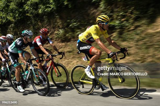 Belgium's Greg Van Avermaet , wearing the overall leader's yellow jersey, rides in the pack during the fifth stage of the 105th edition of the Tour...