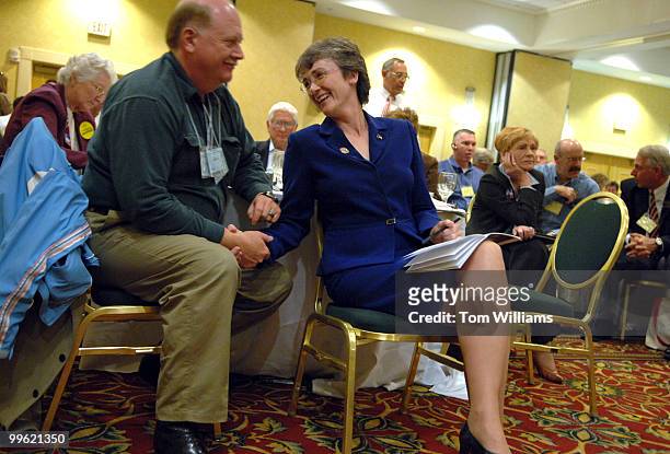 Rep. Heather Wilson, R-N.M., has a word with her husband Jay Hone at the state republican convention at the Marriott hotel in Albuquerque, N.M.