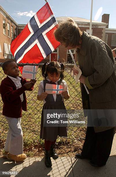 Kendall Conrad and Lizeth Urioso wait with Kari Evans for the arrival of King Harald V and Queen Sonja of Norway, at Thomson Elementary School at 215...
