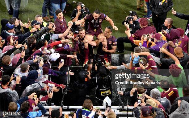 Billy Slater is chaired off after his last game for Queensland after game three of the State of Origin series between the Queensland Maroons and the...